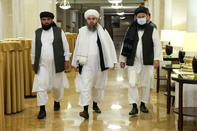 From left, Suhil Shaheen, Mawlawi Shahabuddin Dilawar and Mohammad Naim, members of a political delegation from the Afghan Taliban's movement, arrive for a news conference in Moscow, Russia, Friday, July 9, 2021. (Photo by Alexander Zemlianichenko/AP Photo)