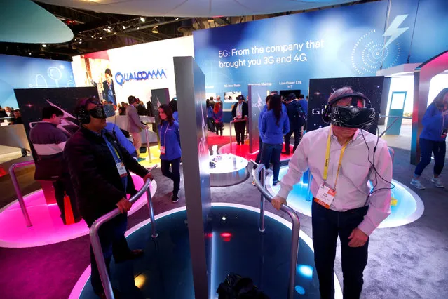 Attendees try out VR headsets at the Qualcomm booth during the 2017 CES in Las Vegas, Nevada January 6, 2017. (Photo by Steve Marcus/Reuters)