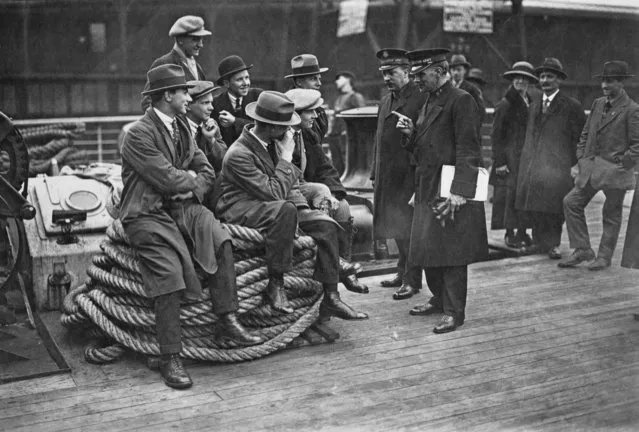 Salvation Army officers giving advice to a group of orphaned boys from the Dr Barnardo's Homes, as they leave for Canada on the 'RMS Antonia', UK, April 1923. (Photo by Topical Press Agency/Hulton Archive/Getty Images)