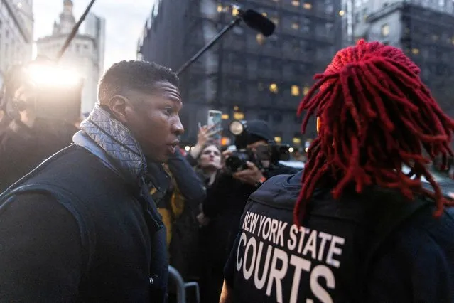 Actor Jonathan Majors walks outside the court after the jury found him guilty in his assault and harassment case at Manhattan Criminal Court in New York City on December 18, 2023. (Photo by Jeenah Moon/Reuters)