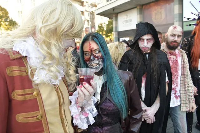 People dressed as zombies attends the 15th Belgrade's Zombie Walk in Belgrade, Serbia, on Saturday, October 30, 2021. (Photo by Goran Srdanov/Nova.rs)