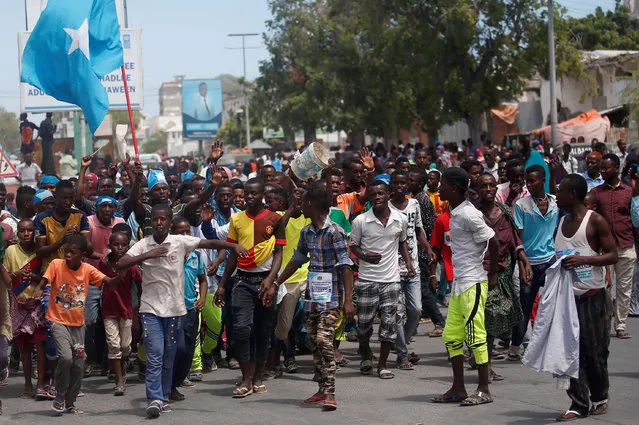 Civilians celebrate the election of President Mohamed Abdullahi Mohamed in the streets of Somalia's capital Mogadishu, February 9, 2017. This election is important because it may establish a pattern of peaceful change of government as well as continue to grow Somalia’s institutions especially for a country that has not heard a stable government for more than two decades. (Photo by Feisal Omar/Reuters)