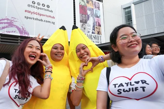 Filipina “Swiftie” Charlyn Suizo poses for a selfie with other fans before a Taylor Swift concert, outside National Stadium in Singapore on March 2, 2024. (Photo by Joseph Campbell/Reuters)