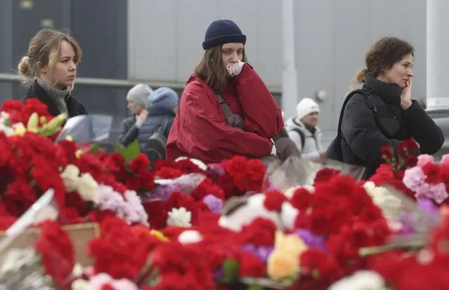 People mourn at the Crocus City Hall concert venue following a terrorist attack in Krasnogorsk, outside Moscow, Russia, 25 March 2024. (Photo by Maxim Shipenkov/EPA/EFE)