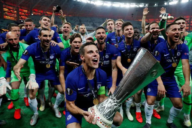 Chelsea's Spanish defender Cesar Azpilicueta celebrates with the trophy after winning the UEFA Europa League final football match between Chelsea FC and Arsenal FC at the Baku Olympic Stadium in Baku, Azerbaijian, on May 29, 2019. (Photo by Lee Smith/Reuters)
