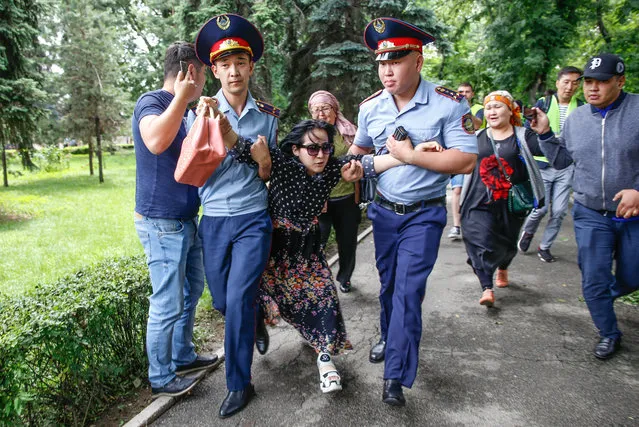 Police officers detain an opposition supporter on June 10, 2019 in Almaty, a day after Kazakhstan's presidential elections. Kazakhstan elected the hand-picked successor of former president Nursultan Nazarbayev with more than 70 percent of the vote, electoral authorities said, after an election day marred by protests. (Photo by Petr Trotsenko/Radio Free Europe/Radio Liberty)
