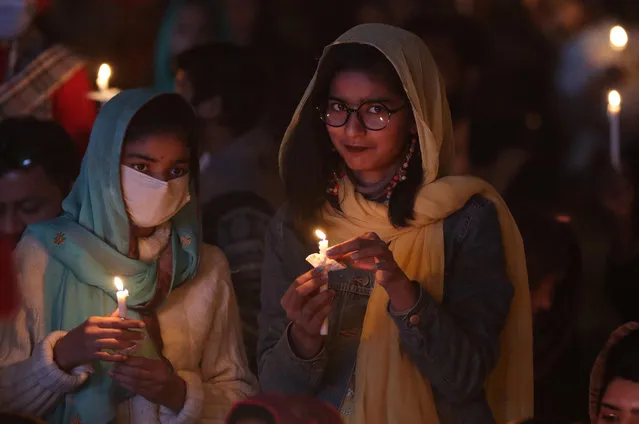 Members of Pakistan's Christian minority attend a service ahead of Christmas in Lahore, Pakistan, 22 December 2021. Pakistan is a majority Sunni Muslim country and home to four million Christians out of a total population of around 200 million people. (Photo by Rahat Dar/EPA/EFE)