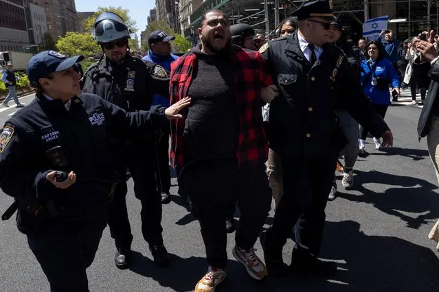 A demonstrator chanting “free Palestine” is detained by police officers outside Columbia University campus as protests continue inside and outside Columbia University, amid the ongoing conflict between Israel and the Palestinian Islamist group Hamas, in New York City, April 22, 2024. (Photo by Caitlin Ochs/Reuters)
