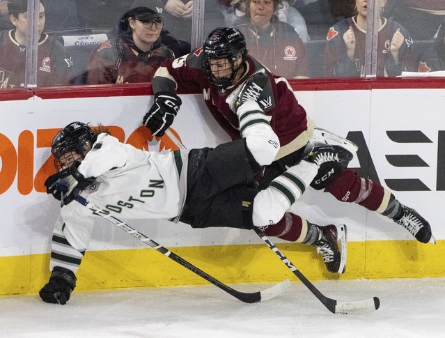 Boston's Sidney Morin, loeft, is upended by Montreal's Melodie Daoust (25) during the second period of Game 1 of a PWHL hockey playoff series Thursday, May 9, 2024, in Montreal. (Photo by Christinne Muschi/The Canadian Press via AP Photo)