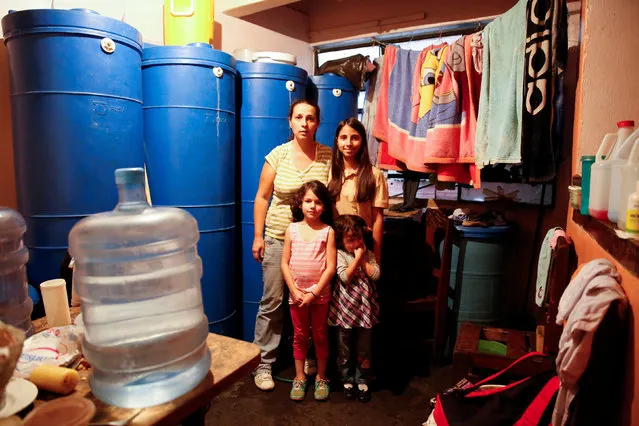 Yaneidy Guzman poses for a picture next to her daughters, Esneidy Ramirez (R), (Front L-R) Steffany Perez and Fabiana Perez, at their home in Caracas, Venezuela April 22, 2016. “Now eating is a luxury, before we could earn some money and buy clothes or something, now everything goes on food” Guzman said. (Photo by Carlos Garcia Rawlins/Reuters)
