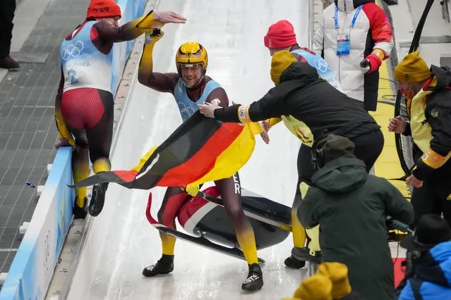 Johannes Ludwig, of Germany, celebrates winning the gold medal in luge men's singles at the 2022 Winter Olympics, Sunday, February 6, 2022, in the Yanqing district of Beijing. (Photo by Mark Schiefelbein/AP Photo)