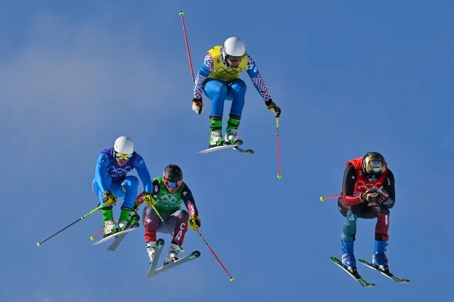 (From L to R) Italy's Simone Deromedis, Canada's Brady Leman, Russia's Sergey Ridzik and Switzerland's Alex Fiva compete in the freestyle skiing men's ski cross semi-finals during the Beijing 2022 Winter Olympic Games at the Genting Snow Park P & X Stadium in Zhangjiakou on February 18, 2022. (Photo by Ben Stansall/AFP Photo)