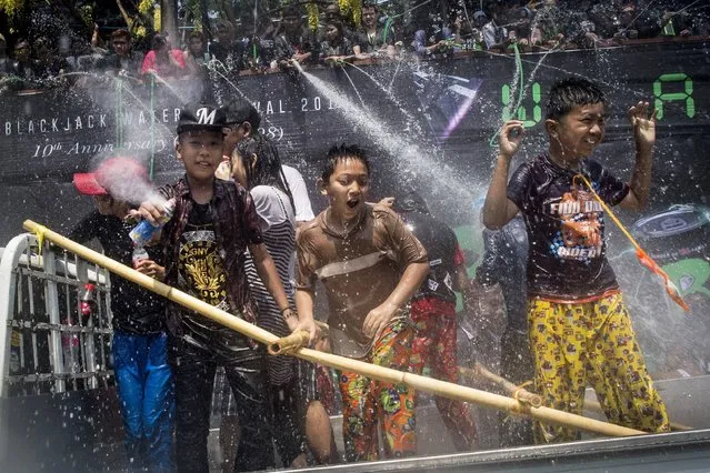 Revellers take part in celebrations marking Thingyan, a water festival which brings in the country's new year, in Yangon on April 13, 2017. The four southeast Asian nations of Myanmar, Thailand, Cambodia and Laos started the Buddhist new year, known as Thingyan in Myanmar and Songkran in Thailand, on April 13. (Photo by Ye Aung Thu/AFP Photo)