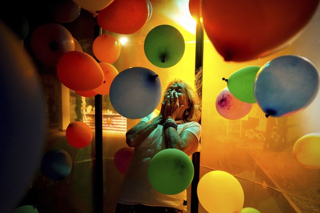 Beverly “Cookie” Grant reacts to the Fanflashtic experience, an operational replica of one constructed at the Woodstock Music and Art Fair, at the Museum At Bethel Woods, Friday, June 14, 2024, in Bethel, N.Y. (Photo by Julia Nikhinson/AP Photo)