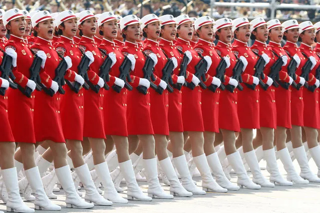 Militia members march in formation past Tiananmen Square during the military parade marking the 70th founding anniversary of People's Republic of China, on its National Day in Beijing, China on October 1, 2019. (Photo by Thomas Peter/Reuters)