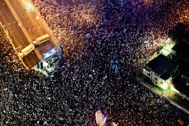 This aerial view shows people protesting in Tel Aviv against the government's controversial judicial overhaul bill, on March 25, 2023. (Photo by Ahmad Gharabli/AFP Photo)