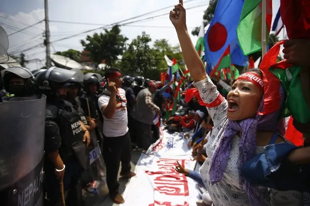 An activist  belonging to Nepalese ethnic-based political parties shout anti government slogans while marching to Primie Minister K.P. Sharma Oli's official residence in Kathmandu, Nepal, 17 May 2016. Thousands members of Ethnic Madhesi groups and other indigenous communities launched a fresh protests against the new constitution, demanding more political representation for ethnic minorities in the nation's parliament. (Photo by Narendra Shrestha/EPA)