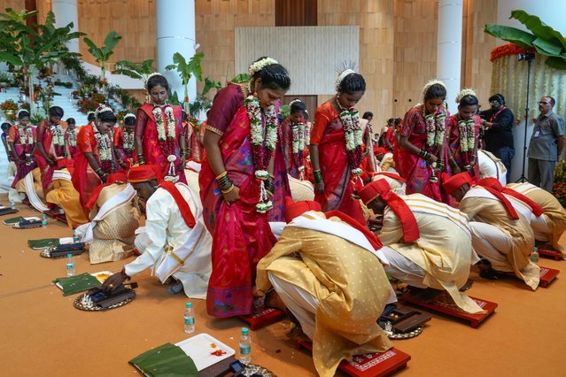 Underprivileged couples take part in a mass wedding organised by Chairman of Reliance Industries Limited Mukesh Ambani as the part of pre- wedding celebrations of his youngest son, Anant Ambani in Navi Mumbai, India, Tuesday, July 2, 2024. (Photo by Rafiq Maqbool/AP Photo)