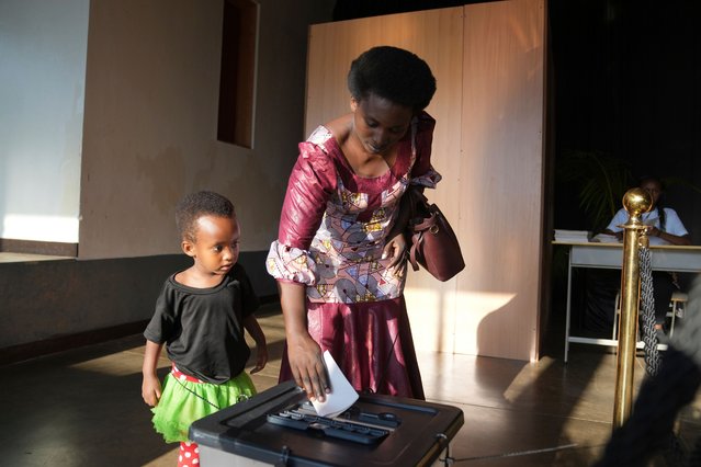 A woman casts her vote in a presidential election in Kigali, Rwanda Monday, July. 15, 2024. Rwandans are voting in an election that is expected to extend the 30-year rule of President Paul Kagame. (Photo by Brian Inganga/AP Photo)