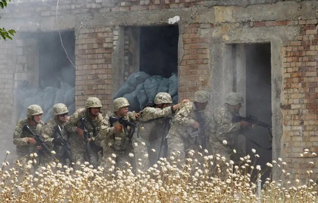 Georgian soldiers take part in a joint military exercise with NATO members, called “Agile Spirit 2015” at the Vaziani military base outside Tbilisi, Georgia, July 21, 2015. (Photo by David Mdzinarishvili/Reuters)