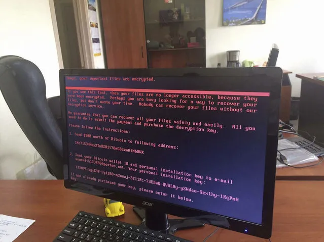 A computer screen cyberattack warning notice reportedly holding computer files to ransom, as part of a massive international cyberattack, at an office in Kiev, Ukraine, Tuesday June 27, 2017,   A new and highly virulent outbreak of malicious data-scrambling software appears to be causing mass disruption across Europe, hitting Ukraine especially hard.  Image used with permission of the account holder facebook.com/olejmaa checked and consistent with independent AP reporting.  (Photo by Oleg Reshetnyak via AP Photo)