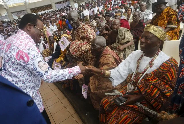 Pascal Affi N'Guessan of the Ivorian Popular Front (FPI) party greets a chief as he arrives at a ceremony for his official inauguration as a presidential candidate for Ivory Coast's upcoming presidential election, at the Culture Palace of Abidjan in Treichville, August 8, 2015. (Photo by Thierry Gouegnon/Reuters)