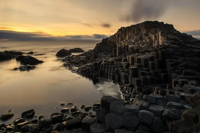The Giant’s Causeway in County Antrim, Northern Ireland, is an area of about 40,000 interlocking basalt columns, the result of an ancient volcanic eruption. (Photo by Tonnaja.com/Getty Images)