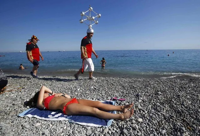 Football Soccer, Euro 2016, Nice, France on June 22, 2016. Belgium fan wears a model of the Atomium on his head in Nice, France. (Photo by Wolfgang Rattay/Reuters)