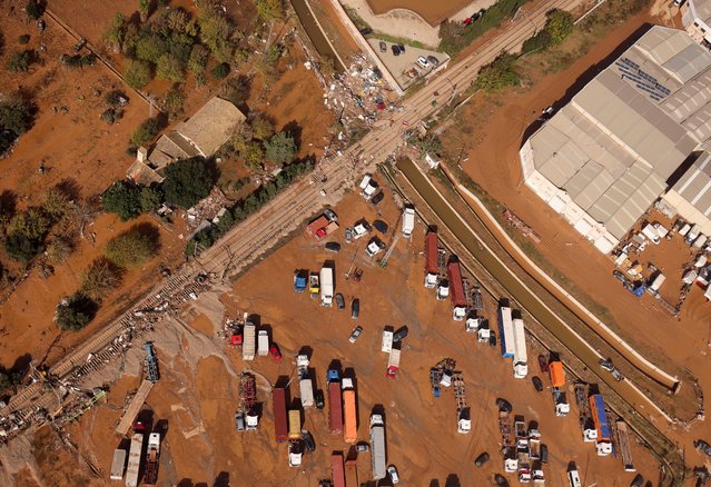 A view shows damaged vehicles in an area affected by heavy rains that caused flooding near Valencia, Spain on October 31, 2024. (Photo by Nacho Doce/Reuters)
