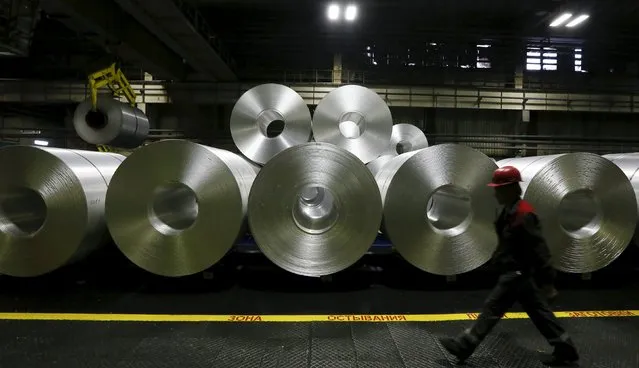 An employee walks past rolls of aluminum foil in a shop of the Rusal's SAYANAL foil mill outside the town of Sayanogorsk, Russia, September 3, 2015. (Photo by Ilya Naymushin/Reuters)