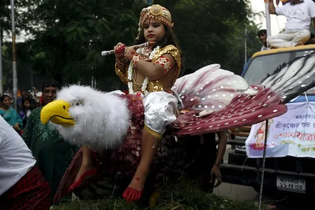 A boy dressed as Lord Krishna takes part in celebrations to mark the Janmashtami festival in Dhaka, Bangladesh September 5, 2015. The festival, which marks the birth anniversary of Lord Krishna, is being celebrated on Saturday. (Photo by Ashikur Rahman/Reuters)