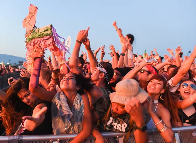 In this Sunday, July 31, 2016, photo, people attend the HARD Summer Music Festival at the Auto Club Speedway in Fontana, Calif. Authorities say multiple people died after attending the weekend rave. Their deaths were not believed to be related, and each was being investigated separately, according to the San Bernardino County Sheriff's Department. It was not yet known what led to the deaths, but extreme heat has not been ruled out as a possible cause. (Photo by John Valenzuela/The Sun via AP Photo)