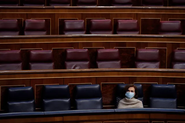 Spain's Deputy Prime Minister Carmen Calvo listens to the proceedings during a parliamentary session in Madrid, Spain, Wednesday May 6, 2020. Spanish Prime Minster Pedro Sanchez is appearing before Spain's Parliament on Wednesday to ask for a fourth two-week extension of the state of emergency that has allowed his government to apply a strict lockdown in response to the COVID-19 outbreak. It appears he will have the support despite losing the backing of the main opposition party. (Photo by J.J. Guillen/Pool Photo via AP Photo)