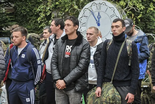 Russian conscripted men attend a farewell ceremony outside a recruiting office in Bataysk, Rostov region, Russia, 26 September 2022. Russian President Putin has signed a decree on partial mobilization in the Russian Federation. Russian Defense Minister Sergei Shoigu said that 300,000 people would be called up as part of partial mobilization. On 24 February 2022 Russian troops entered the Ukrainian territory in what the Russian president declared a “Special Military Operation”, starting an armed conflict that has provoked destruction and a humanitarian crisis. (Photo by Arkady Budnitsky/EPA/EFE)