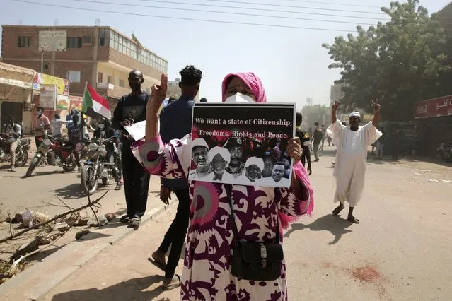 Sudanese demonstrators attend rally to demand the return to civilian rule nearly a year after a military coup led by General Abdel Fattah al-Burhan, in Khartoum, Sudan, Tuesday, October 25, 2022. (Photo by Marwan Ali/AP Photo)