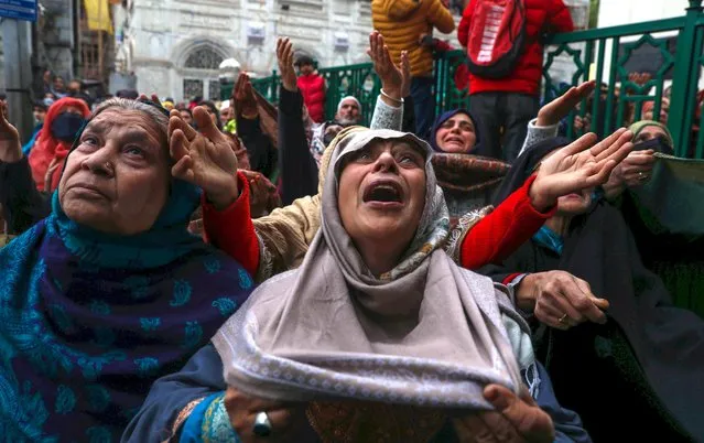 Muslim devotees pray and react as a priest (not in picture) displays a relic of Sheikh Syed Abdul Qadir Jeelani at his shrine in Srinagar, India, 07 November 2022. Devotees thronged to the shrine housing the relic, believed to be a hair strand from his beard, as part of an 11-day festival to mark the death anniversary of the 11th and 12th century Sufi mystic saint Sheikh Syed Abdul Qadir Jilani. (Photo by Farooq Khan/EPA/EFE/Rex Features/Shutterstock)