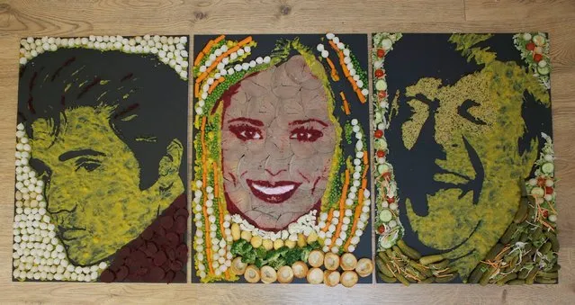 Portraits of (left-right) Elvis Presley, Cheryl Fernandez Versini and Stephen Fry, made out of Haywards Pickled Vegetables, created by food artist Nathan Wyburn for the brand's liven up meal times campaign, at Barnabus Arts House in Newport, Wales, on October 23, 2014. (Photo by Jim Ross/PA Wire)