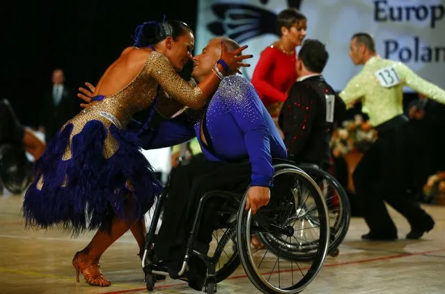 Pawel Karpinski and Nadine Kinczel of Poland dance as they compete during IPC Wheelchair Dance Sport European Championships in Lomianki near Warsaw, November 9, 2014. (Photo by Kacper Pempel/Reuters)