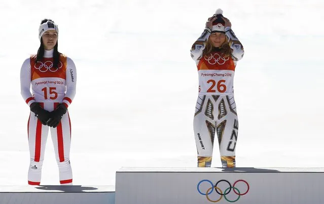 Anna Veith (left to right, silver) from Austria and Ester Ledecka (gold) from the Czech Republic celebrating during the award ceremony of the women' s alpine skiing super G event in the Jeongseon Alpine Centre in Pyeongchang, South Korea, 17 February 2018. (Photo by Leonhard Foeger/Reuters)