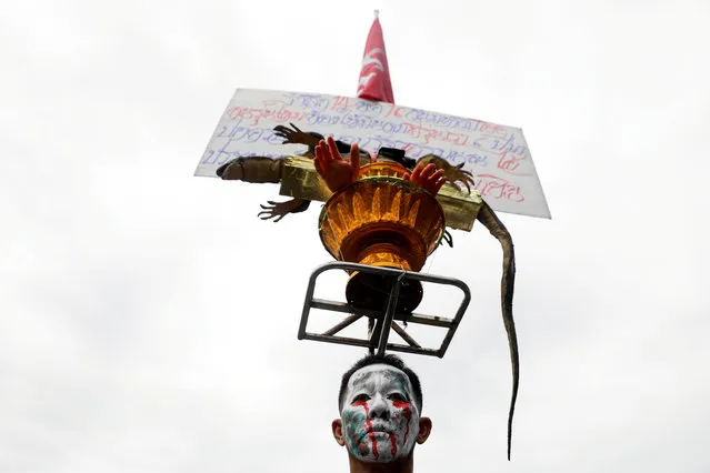 A person takes part in a Thai anti-government mass protest, on the 47th anniversary of the 1973 student uprising, near the Democracy monument, in Bangkok, Thailand on October 14, 2020. (Photo by Soe Zeya Tun/Reuters)