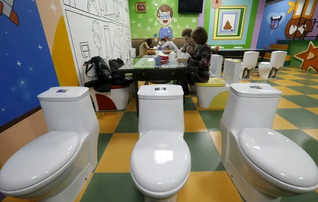 Customers sit at Crazy Toilet Cafe in central Moscow, Russia October 30, 2015. (Photo by Sergei Karpukhin/Reuters)