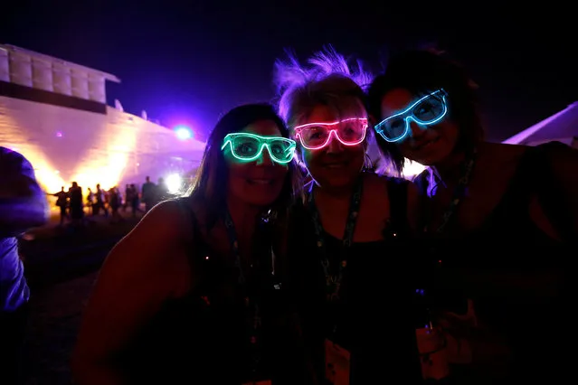 Concertgoers Michelle Amaradio (L), Jo-Ann Walsh (C) and Cami Kelley pose for a photo at Desert Trip music festival at Empire Polo Club in Indio, California U.S., October 9, 2016. (Photo by Mario Anzuoni/Reuters)