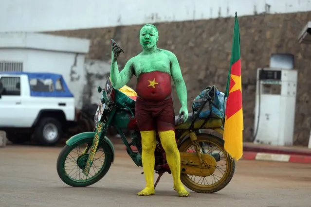 A Cameroon fan arrives at the Olembe Stadium in Yaoundé on January 9, 2022 for his team’s opening match against Burkina Faso in the Africa Cup of Nations. Cameroon won 2-1. The tournament runs until February 6. (Photo by Mohamed Abd El Ghany/Reuters)