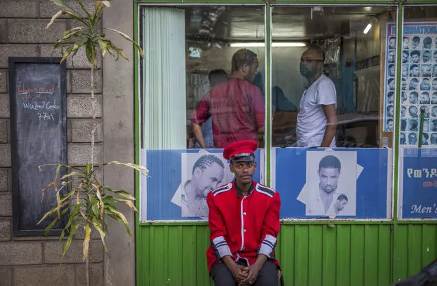 A security guard sits near a gate in Addis Ababa, Ethiopia Monday, October 10, 2016. Ethiopia's government on Monday blamed Egypt for supporting outlawed rebels and forcing the declaration of the country's first state of emergency in a quarter-century as widespread anti-government protests continue, though Egypt last week denied any support for the Ethiopian rebels. (Photo by Mulugeta Ayene/AP Photo)