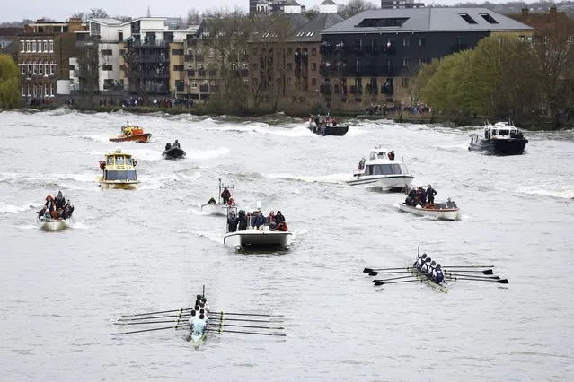 Cambridge is seen ahead of Oxford on their way to winning the men's race during the University Boat Race in River Themes, London on March 26, 2023. (Photo by Peter Cziborra/Action Images via Reuters)