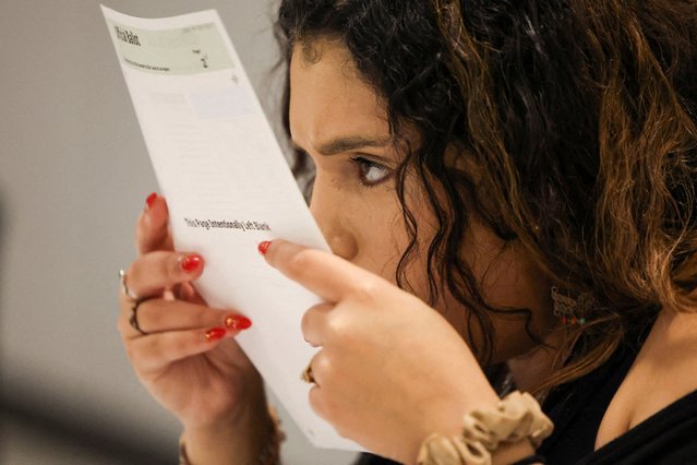 An election worker processes a ballot during a special election on redistricting at the Los Angeles County Ballot Processing Center in City of Industry, California on November 4, 2025. (Photo by Daniel Cole/Reuters)