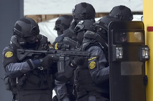 Irish Police (An Garda Siochana) and Emergency Support Unit (ERU) officers demonstrate an operational response to a scenario of an attack and hostage situation on a Port during an emergency training session in Drogheda, Ireland October 27, 2016. (Photo by Clodagh Kilcoyne/Reuters)