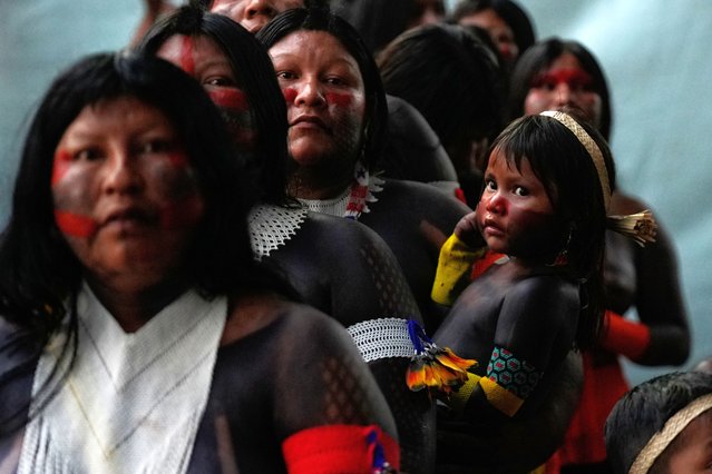 An Indigenous group attends the opening ceremony of the People's Summit on the sidelines of the COP30 U.N. Climate Summit in Belem, Brazil, November 12, 2025. (Photo by Fernando Llano/AP Photo)
