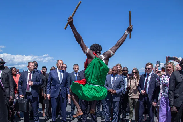 Russian Foreign Minister Sergei Lavrov (C-L) and Burundi foreign minister and international cooperation Albert Nshingiro (C-R) look on as Lavrov is welcomed by Burundian traditional drummers upon his arrival at the Melchior Ndadaye International Airport in Bujumbra on May 30, 2023. (Photo by Tchandrou Nitanga/AFP Photo)