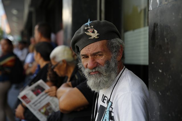 Humberto Garcia, 66, lines up outside a supermarket waiting for any basic goods to be sold in Caracas January 19, 2015. (Photo by Jorge Silva/Reuters)